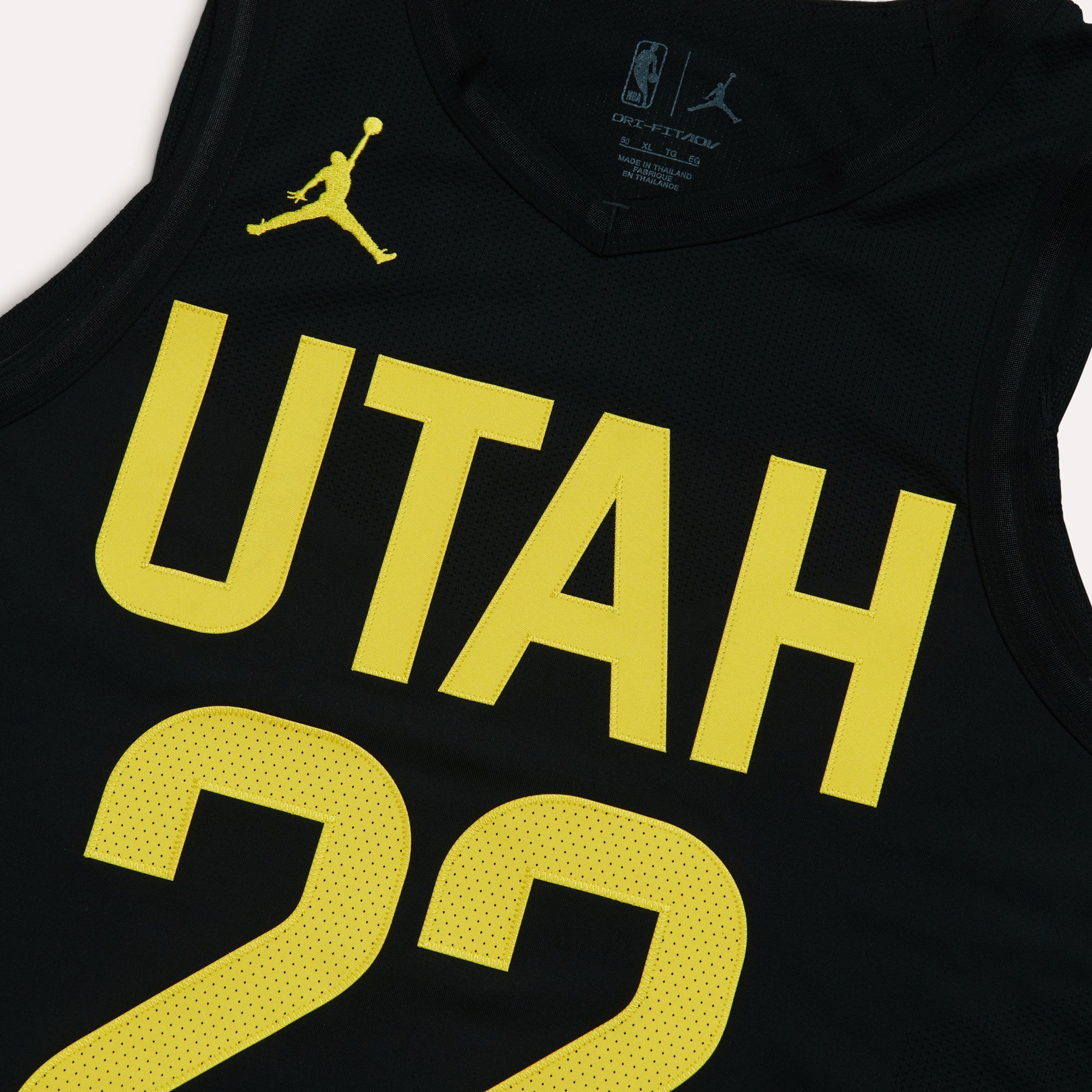 A close up view of the Black Jordan darkmode jersey with yellow accents