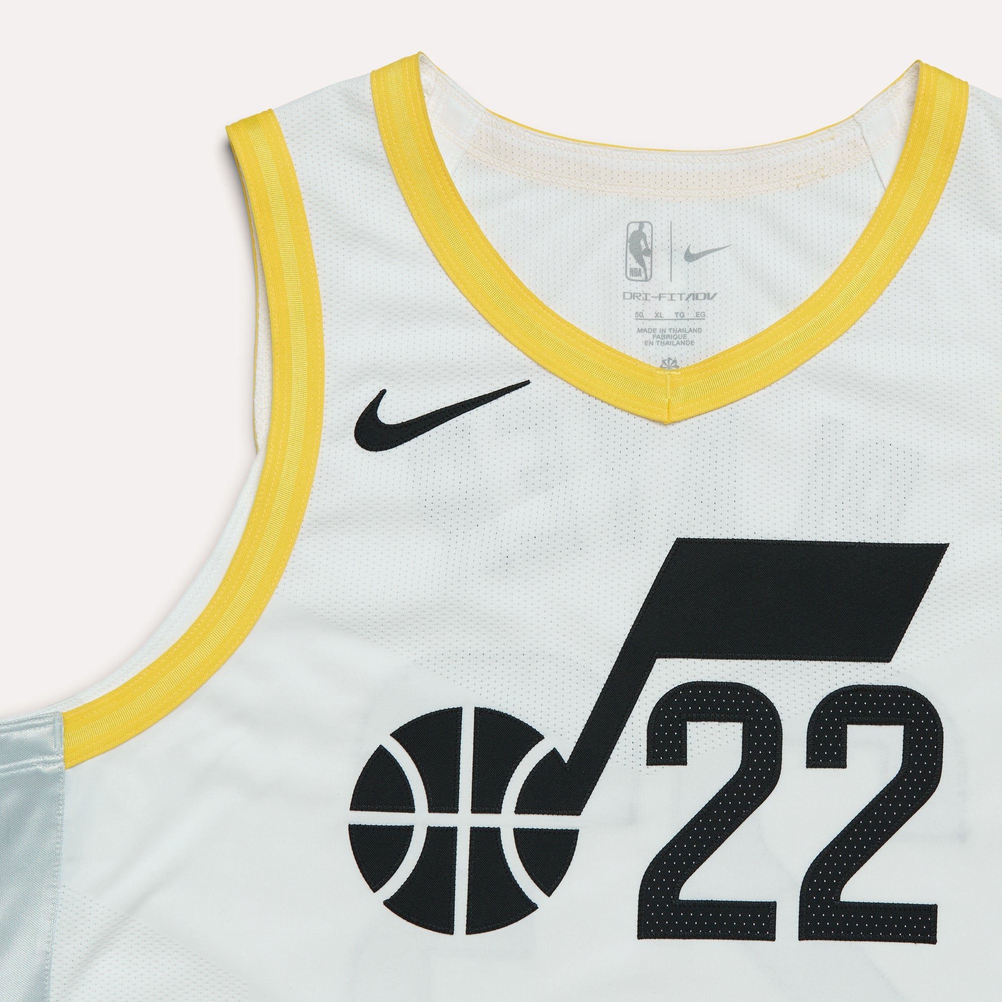 A zoomed in view of the White Nike Association jersey.