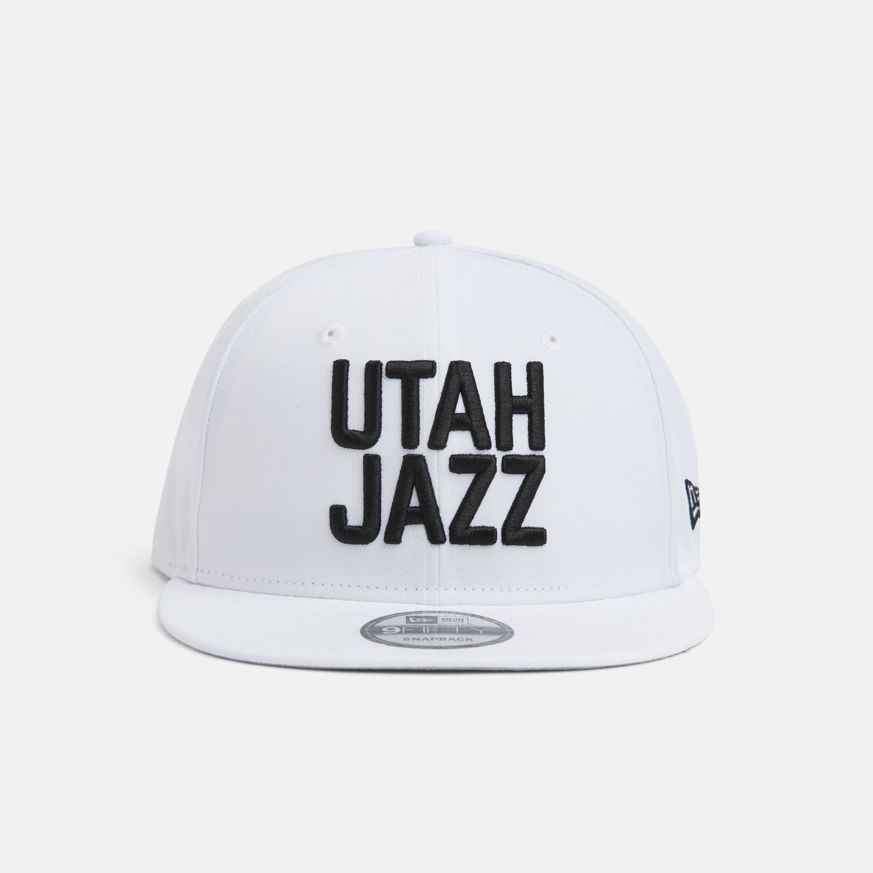 Front white 950 with black stacked Utah Jazz wordmark.