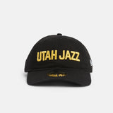 Front black 920 with yellow Utah Jazz wordmark logo.