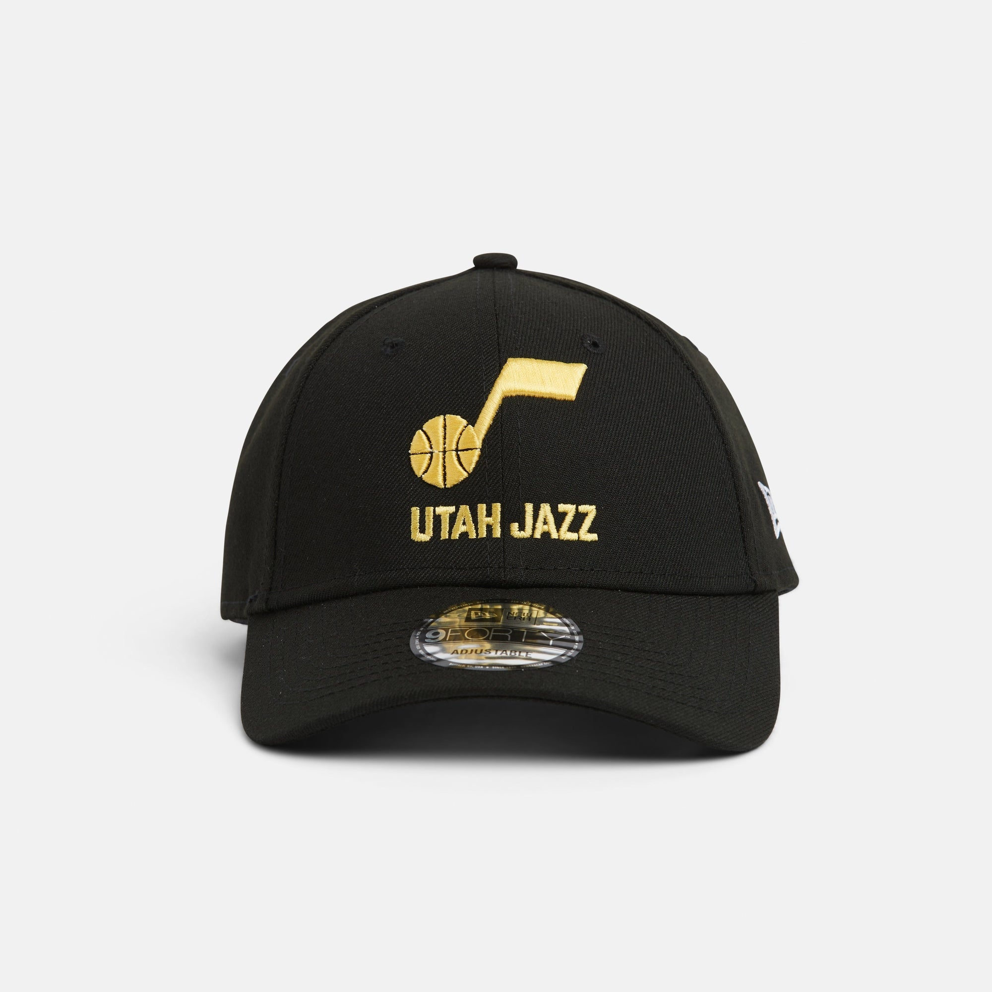 Front black 940 with yellow note and Utah Jazz wordmark logo.